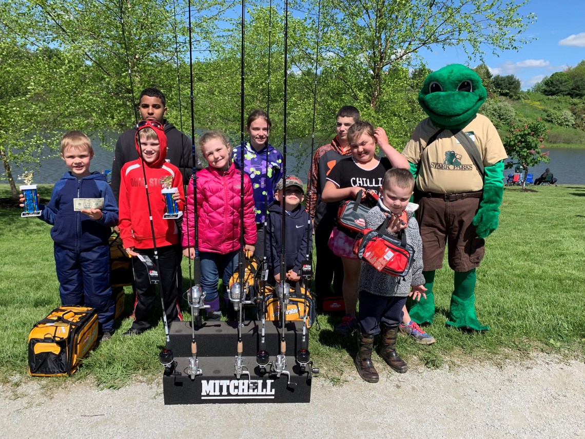 Kids with fishing poles and prizes