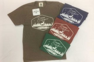 Open and folded tee shirts with Stark County Park District logo