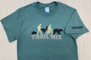 Trail mix written on shirt with logo