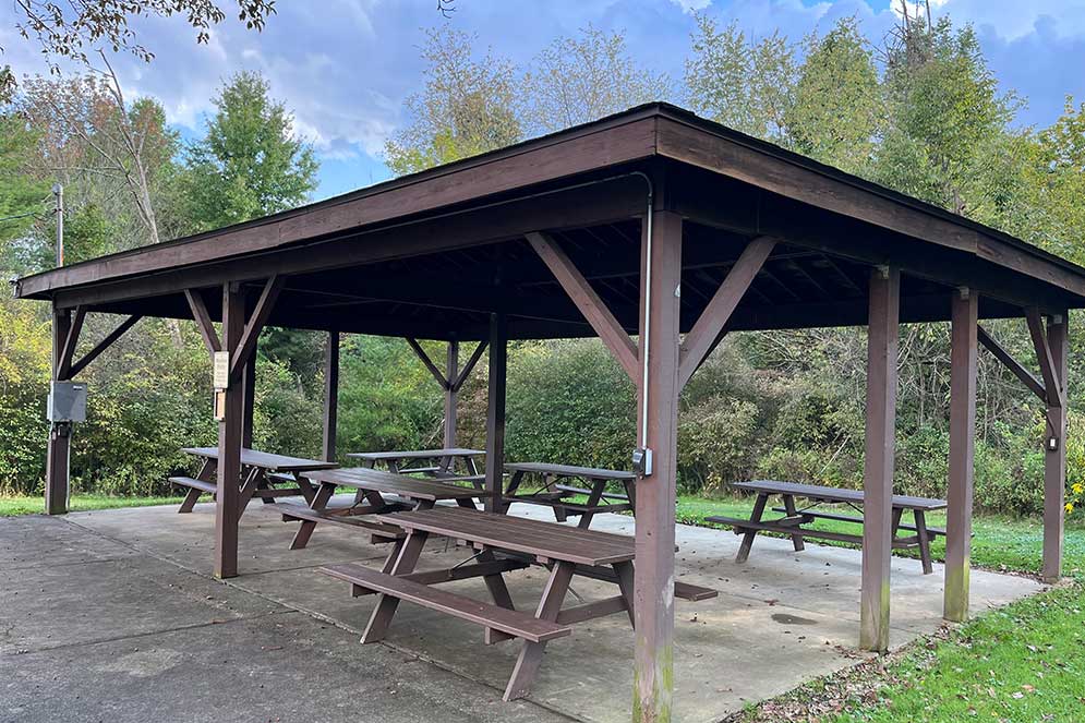 Shelter with six picnic tables