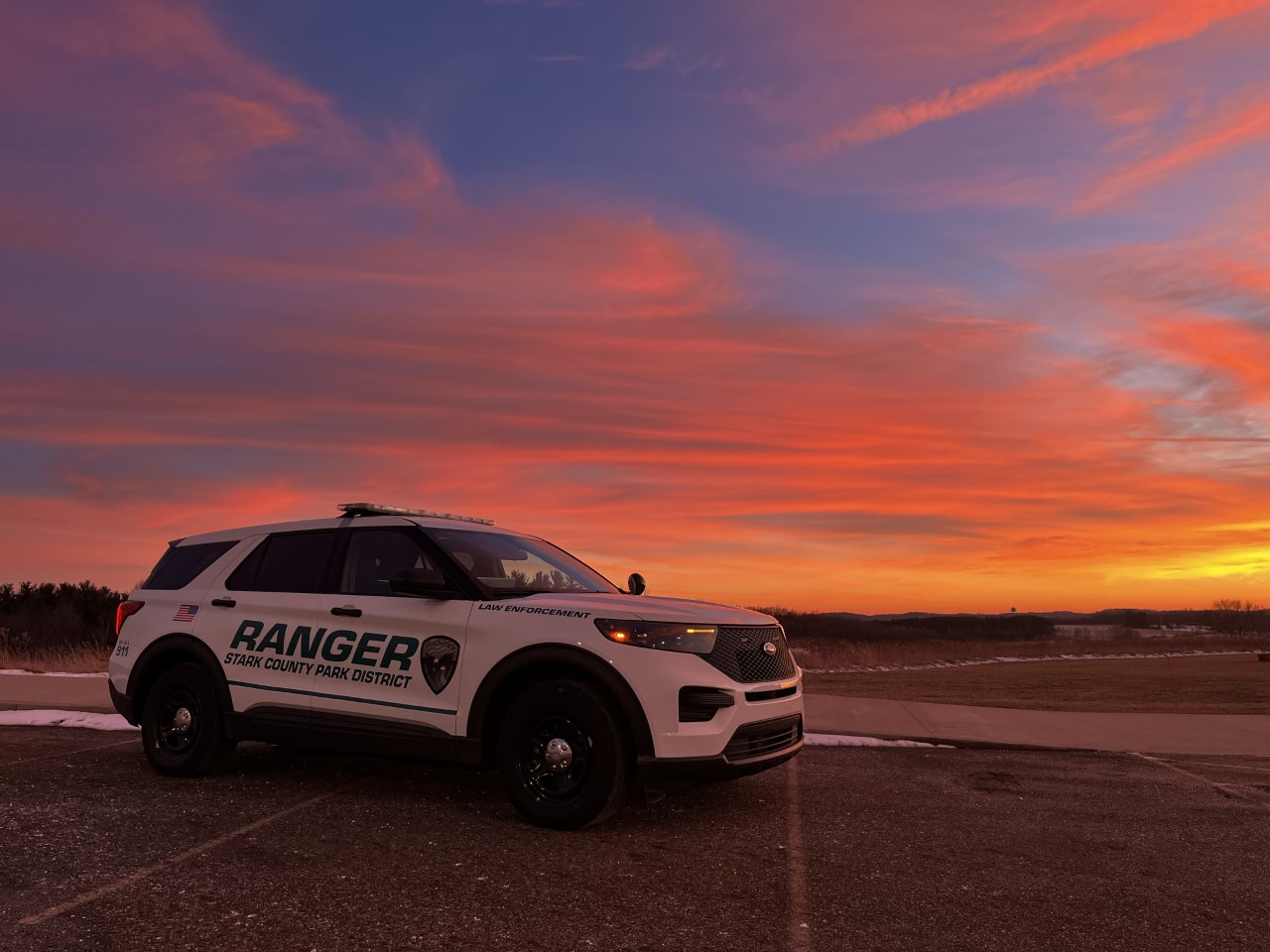 Ranger patrol vehicle with sunset backdrop
