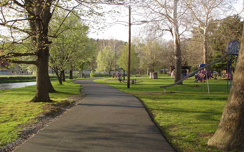 Paved Trail with creek and playground on sides