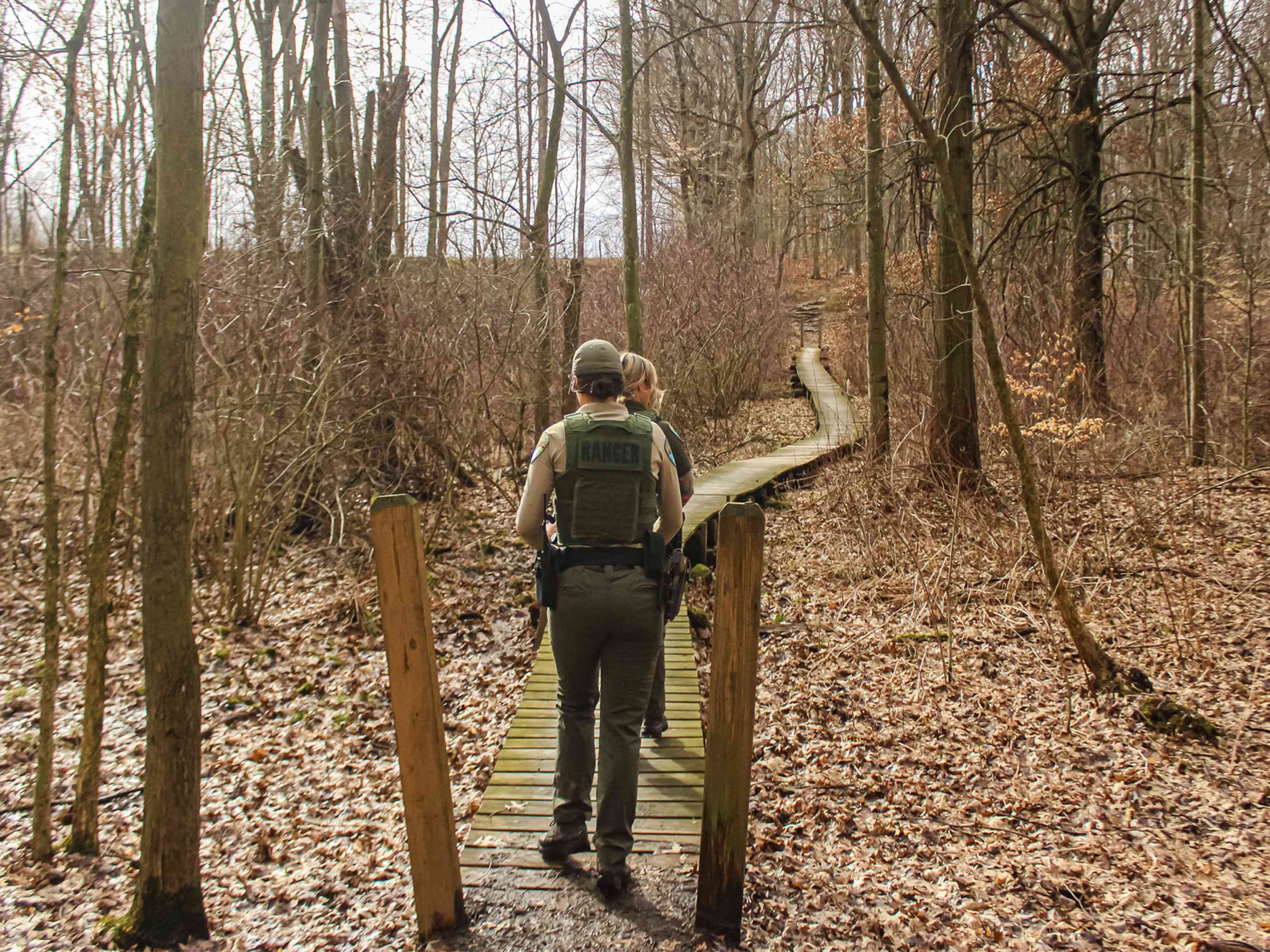 Park Rangers walking on boardwalk