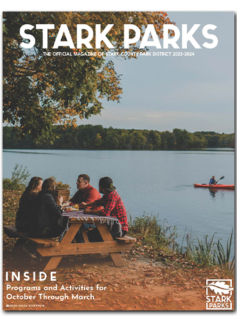Magazine cover with people at picnic table and kayak in background on lake