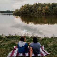 Couple on Blanket looking over Reservoir